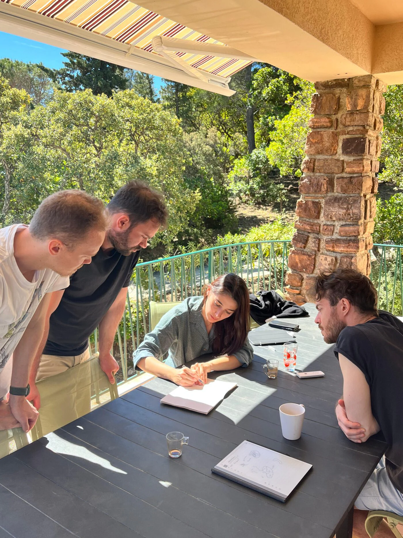 EmerGe collaborators working together around a table
